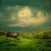 11811999-misterio-paisaje-de-montana-rayo-de-luz-en-las-nubes-oscuras-sobre-la-choza-de-madera-v.jpg